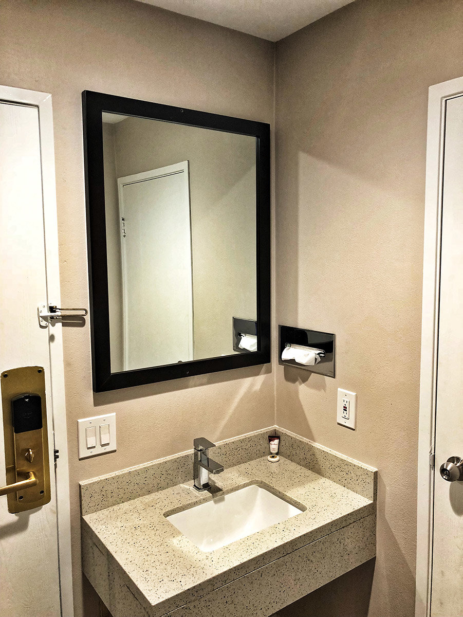 Hotel bathroom sink with mirror