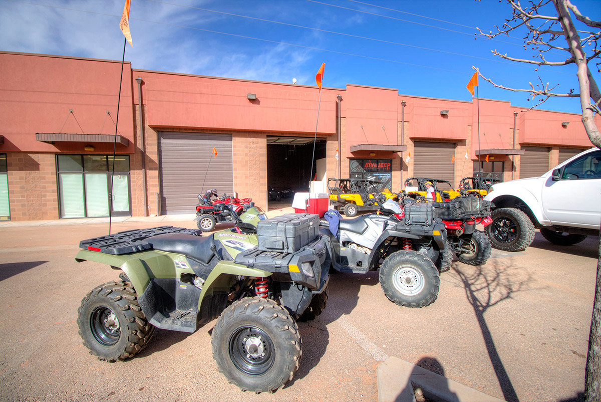 Group of ATVs parked outside storefront