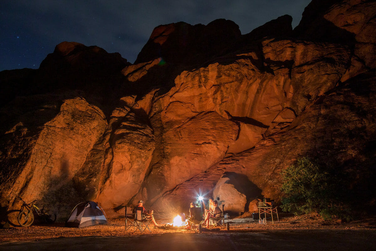 Family seated around campfire