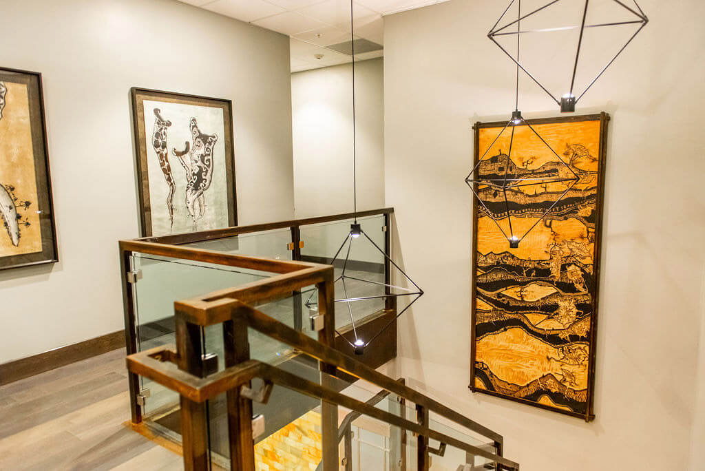 Modern art hanging on wall and staircase