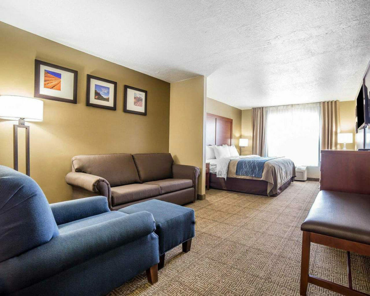 Hotel suite with king bed and seating area