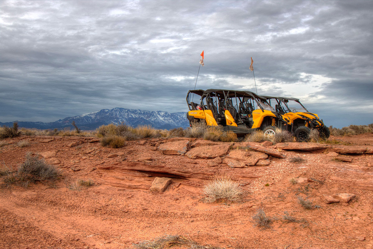 Two yellow Razor OHVs parked on rocky ground