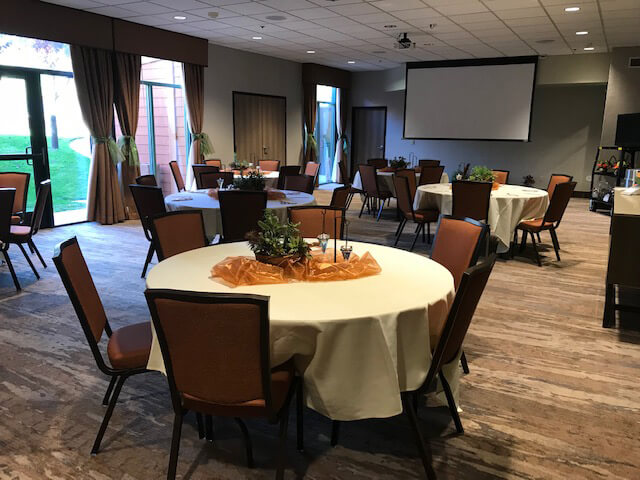 Conferences room tables decorated with flowers