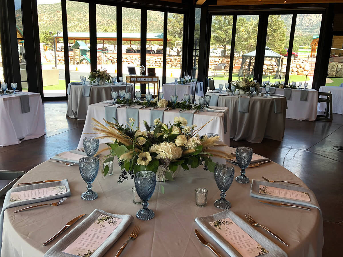 Banquet tables with menus and place settings