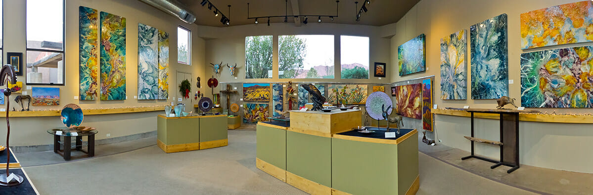 Panoramic view of the interior of an art gallery.
