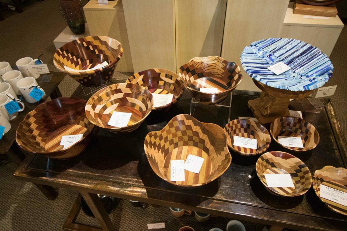 Wooden bowls on display table.