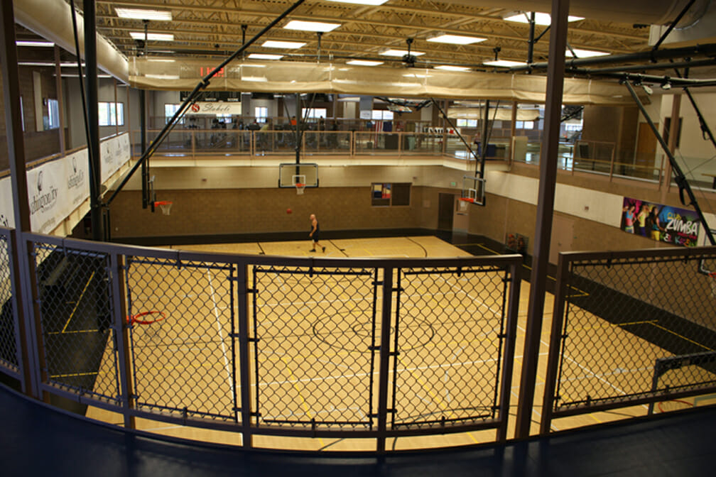 View from catwalk above basketball court with wooden floor
